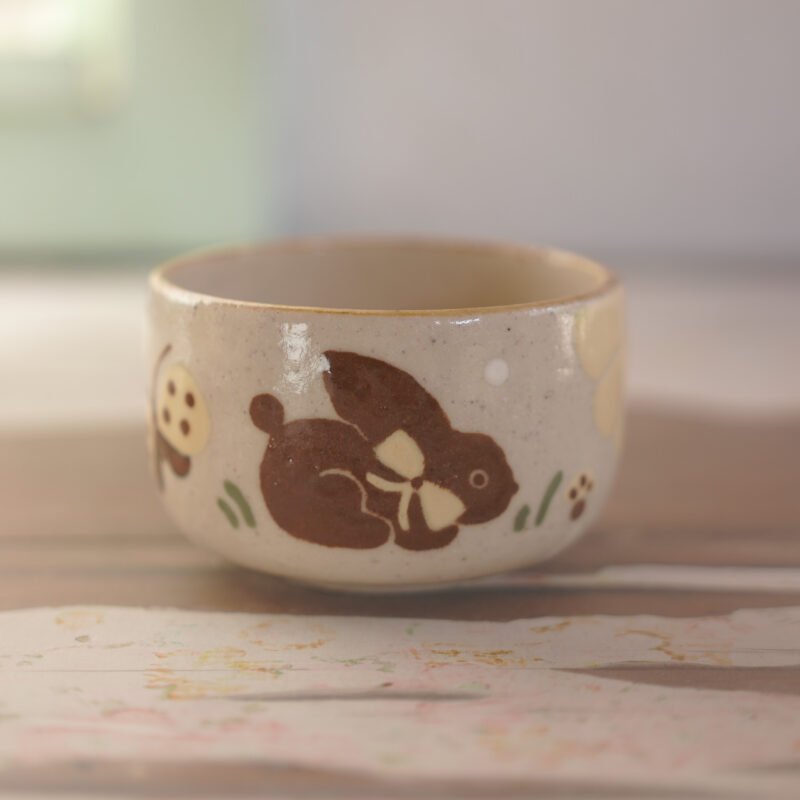 Té / Conejo y flores amarillas