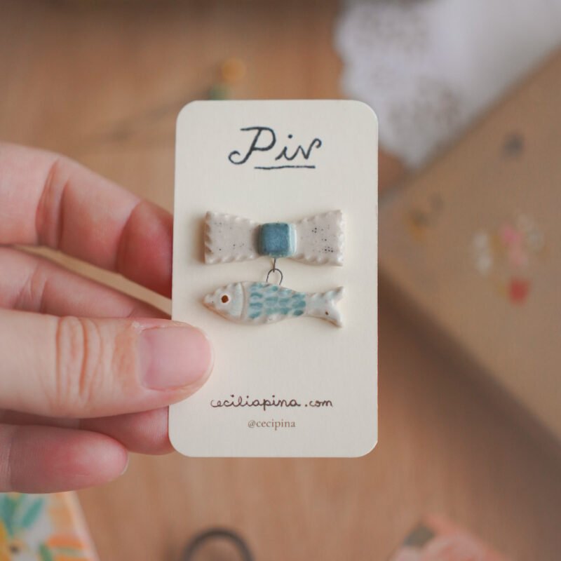 pez con moño / broche charm